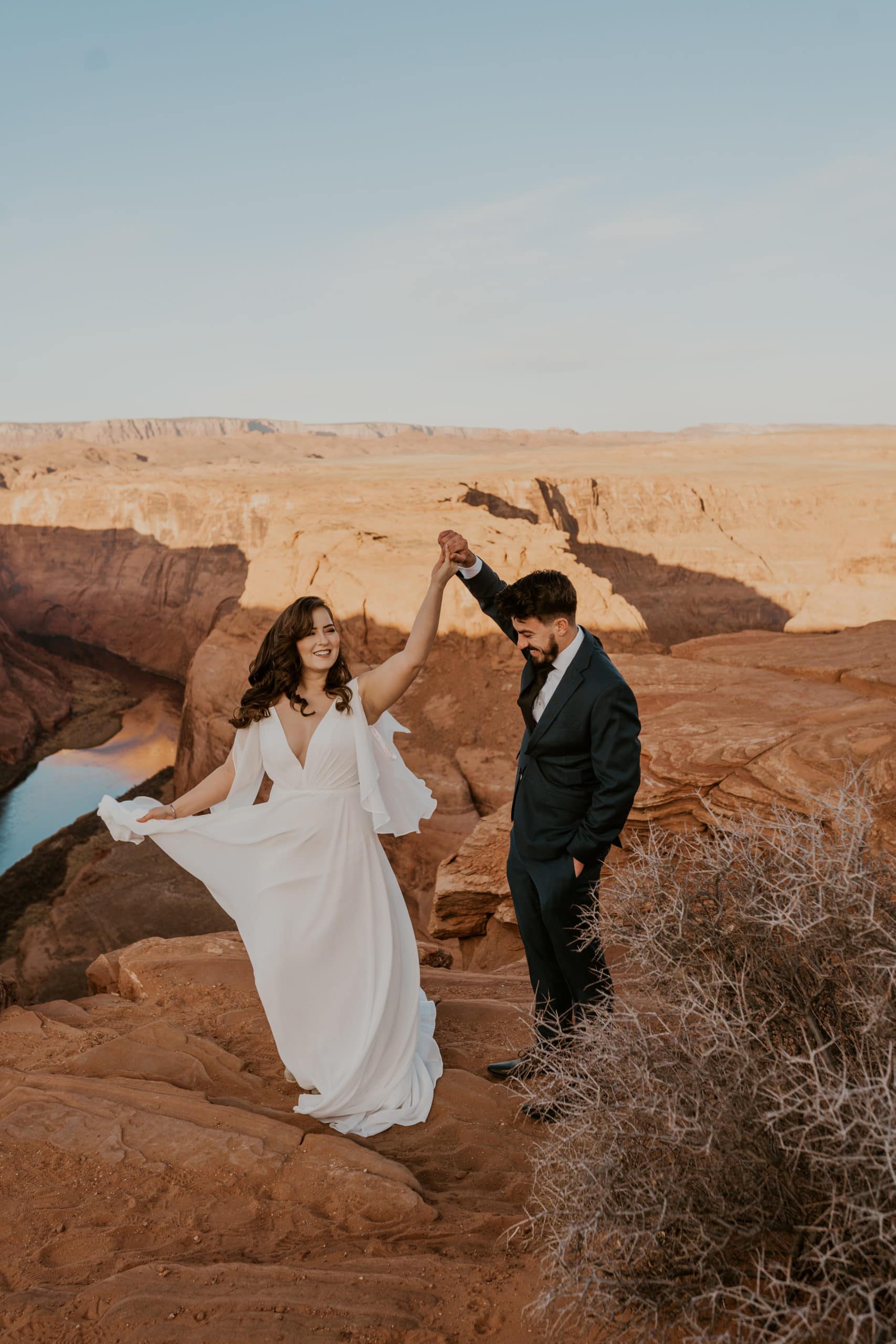 Bride and groom dancing at horseshoe Bend, Arizona