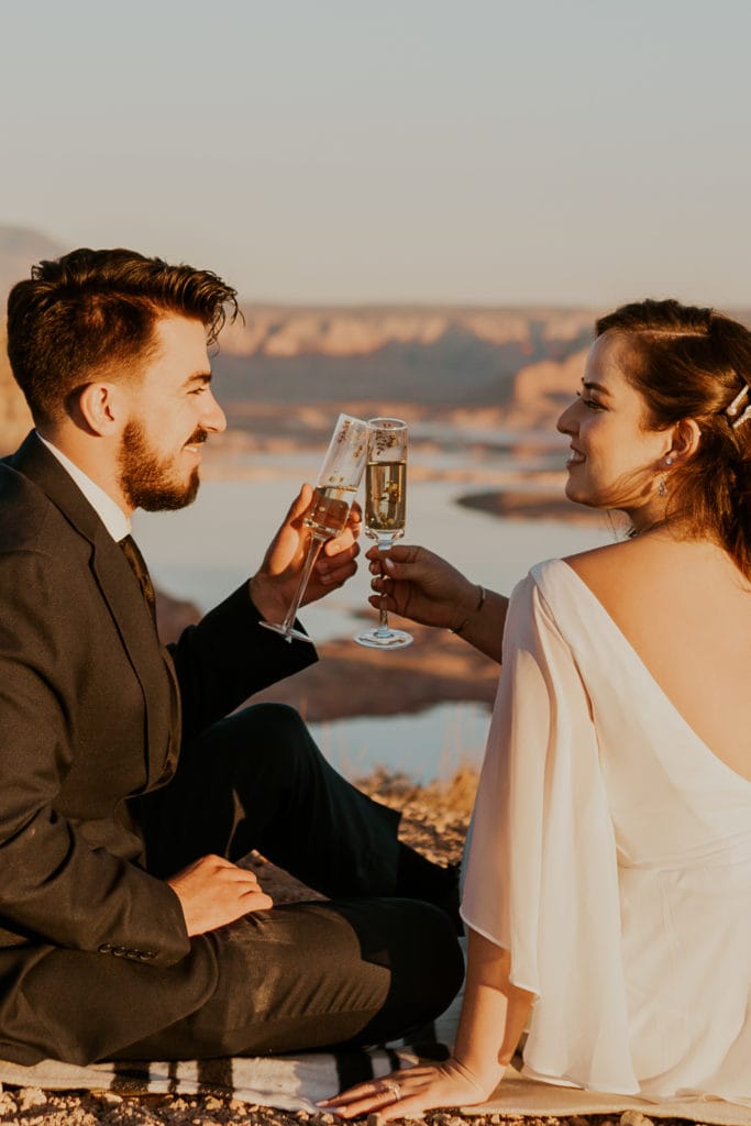 Bride and groom drinking champaign after their lake powell elopement