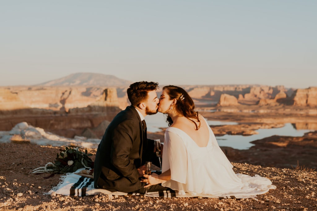 Bride and groom having a picnic after their lake powell elopement