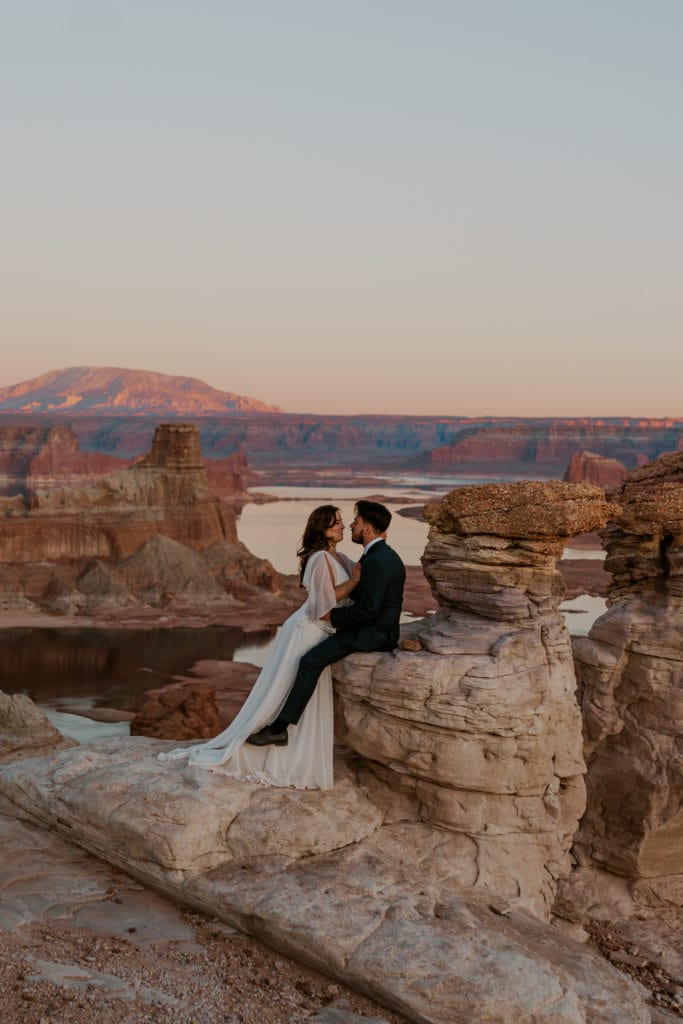 Bride and groom enjoying sunset after their Lake Powell elopement