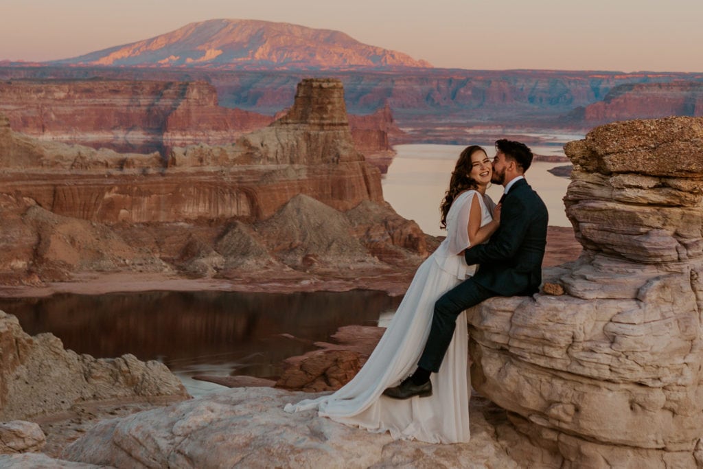 Bride and groom kissing after their Lake Powell elopement